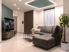 Living room design with sofa, coffee tables and TV stand - Client photo